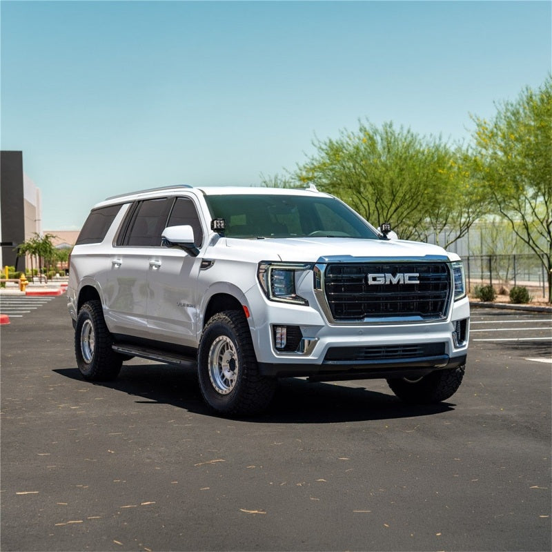 Rigid Industries D-SS light bar kit installed on GMC Yukon and Chevrolet Tahoe/Suburban, showing durable LED light bars and cubes.