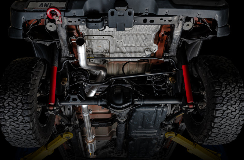 AWE Tuning 2018+ Jeep Wrangler JL/JLU Trail Edition 3.6L Cat-Back Exhaust system installed on vehicle with visible piping and muffler