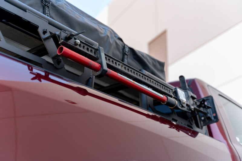 DV8 Offroad MTO Series 2-piece adjustable bed rack installed on Toyota Tundra and Ford F150 Raptor trucks, exterior truck bed accessory