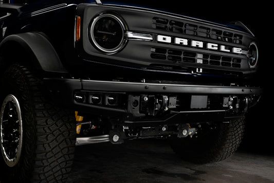 Oracle Lighting 21-22 Ford Bronco triple LED fog light kit installed on steel bumper, white fog lights for off-road vehicles.