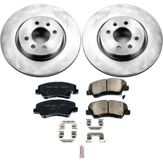 PowerStop OE brake kit for 2012-2018 Kia Rio front brakes, including rotors and calipers, installed on a vehicle.