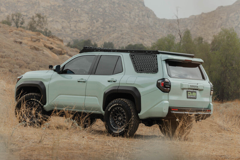 DV8 Offroad Toyota 4Runner exterior window Molle panel for DV8 roof rack driver side, part of the vehicle's roof rack trim system.