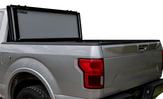 Access 2022+ Nissan Frontier 6ft Bed LOMAX Stance hard fold cover in urethane aluminum, installed on truck bed.