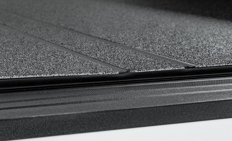 Access LOMAX tri-fold black urethane truck bed cover on 19+ Chevrolet Silverado 1500 with 6ft 6in bed, exterior truck bed accessory.