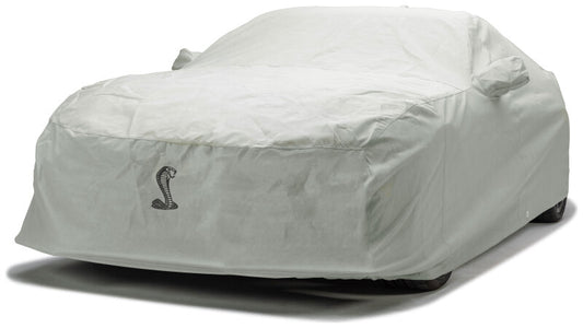 Covercraft custom 99-04 Ford Mustang 3-layer moderate climate car cover with official Ford licensing, protecting the vehicle outdoors.