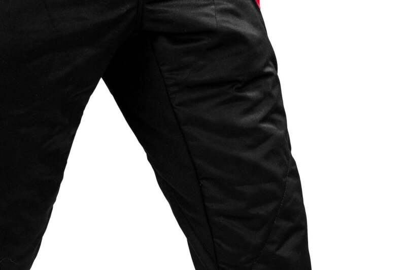 Black and white Sparco competition racing suit with boot cuff, designed for high-performance motorsport safety and style.