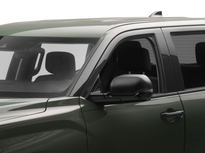 Raxiom Toyota Tundra side mirror with clear sequential LED mirror lights installed on the mirror housing.