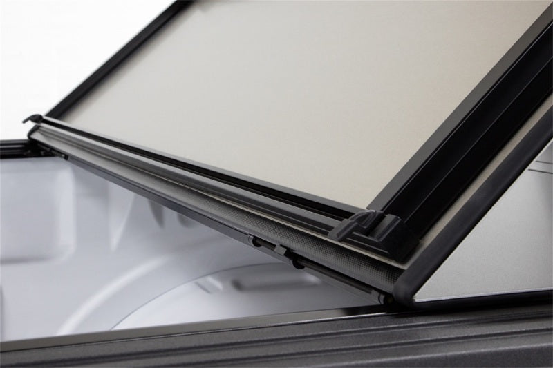 Access LOMAX Pro Series tri-fold hard tonneau cover in black diamond mist for 19+ Chevy/GMC 1500 6ft 6in bed.