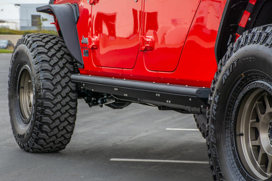 DV8 Offroad Jeep Gladiator side steps and sliders installed on a 2019+ model, providing easy access and side protection.