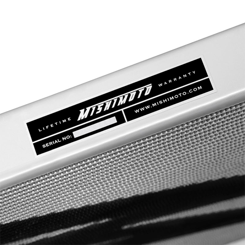 Mishimoto aluminum radiator for 2003-2007 Ford F250 with 6.0L Powerstroke engine, showing the radiator core and fittings.