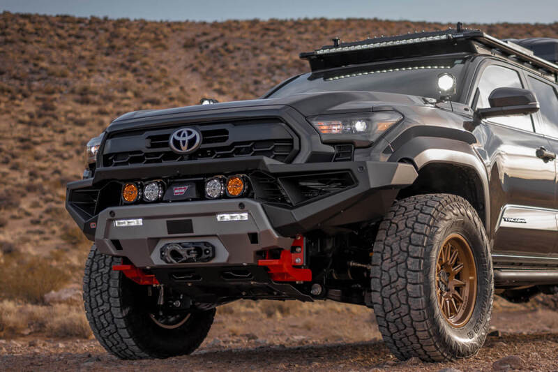 ARB 2024+ Toyota Tacoma Zenith Winch Bar in TXT black, heavy-duty bull bar with integrated winch mount on front of vehicle.