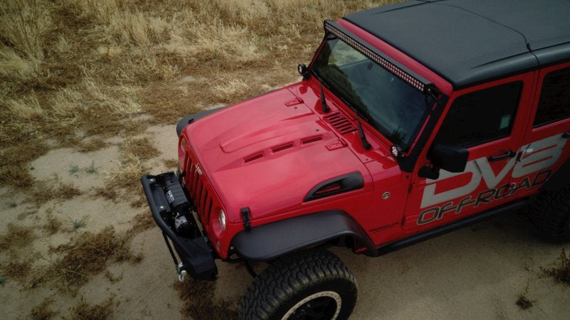 DV8 Offroad Jeep Wrangler JK metal heat dispersion hood in primer black, designed for 2007-2018 models, featuring rugged metal construction.