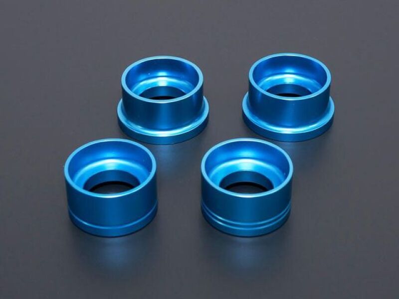 Cusco rear cross member rigid mount collar set in blue for Toyota GR Yaris 2021+ AWD, billet aluminum bushing kit.