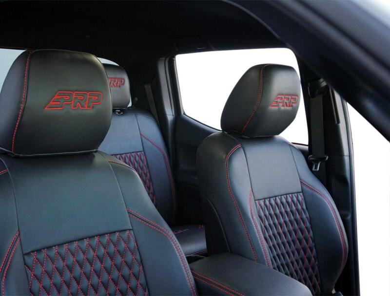 Pair of PRP Seats black and olive green front seat covers for Toyota Tacoma, made of durable fabric with reinforced stitching.