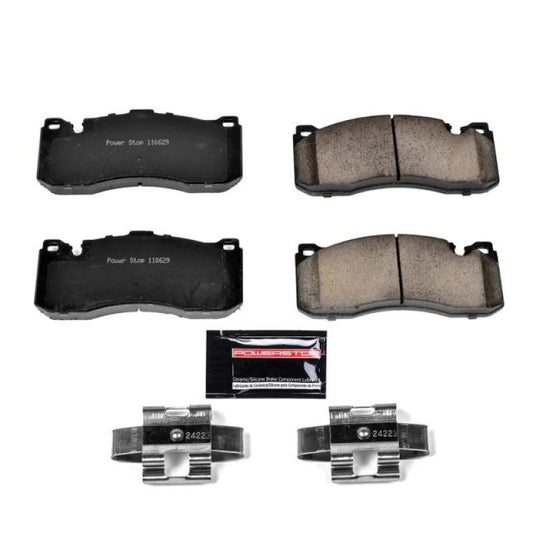 PowerStop Z23 Evolution Sport brake pads for BMW 135i front, showing the black brake pad with hardware components.