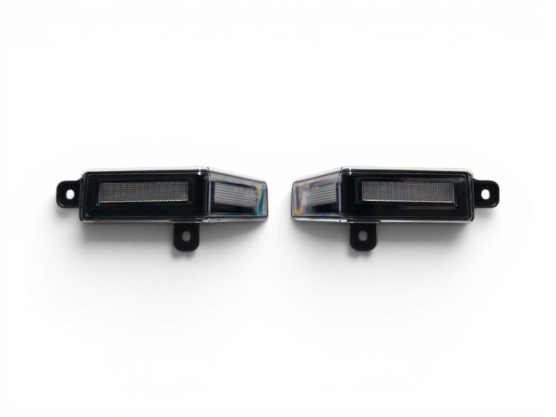Raxiom 22-26 Toyota Tundra LED license plate and reverse bulbs with clear lenses, designed for improved visibility and style.