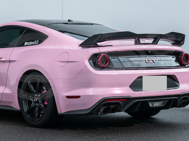 Dark Horse style carbon fiber rear wickerbill spoiler wing on a 2015-2023 Ford Mustang, showing the sleek aerodynamic design.