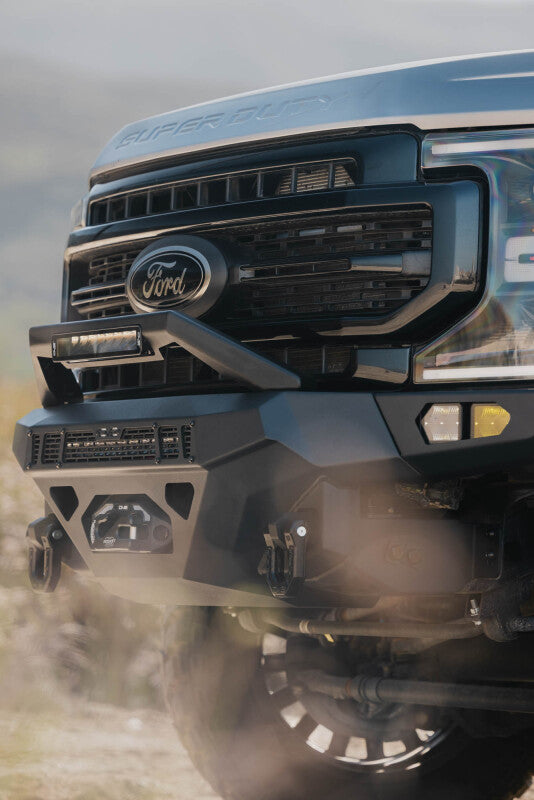 Steel front bumper for Ford Super Duty F-250/F-350 by DV8 Offroad, part of the Spec Series, shown on a pickup truck.