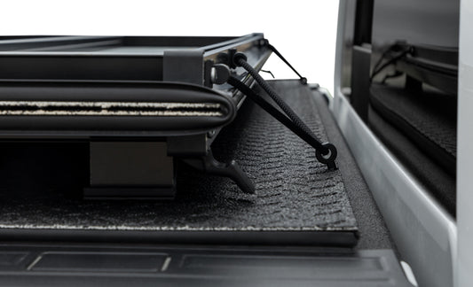 Access 2023+ GM Colorado/Canyon 5ft Bed LOMAX diamond plate hard fold tonneau cover on pickup truck bed.