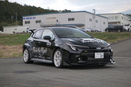 HKS Type-S GR Corolla body kit with R-spoiler, showcasing a sleek aerodynamic design on a sporty hatchback.
