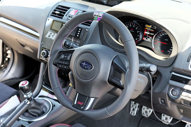 HKS Subaru WRX STI VAB replacement steering wheel, black with textured grip, designed for performance and durability.
