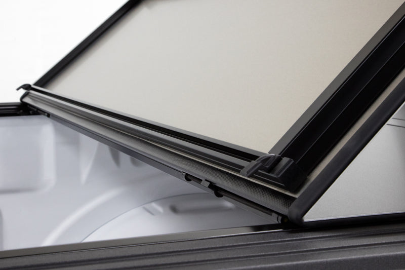 Access LOMAX Pro Series 19+ Chevy/GMC full-size 1500 hard fold tonneau cover in Black Diamond Mist with carbon fiber look.