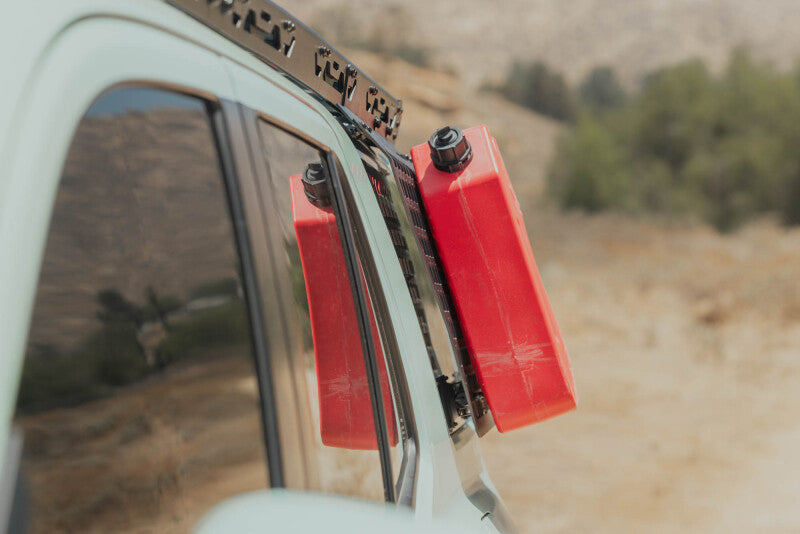 DV8 Offroad exterior window Molle panel for Toyota 4Runner 25-26, mounted on roof rack, made of durable trim material.