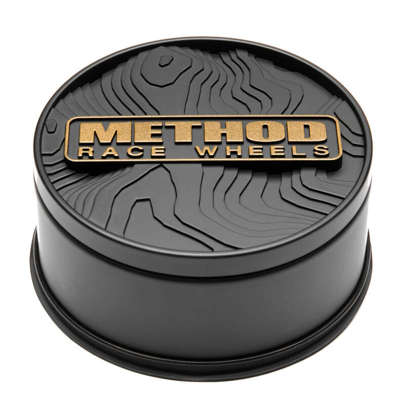 Bronze Method Wheels center cap with push-through design, suitable for wheel centers, featuring the Method Wheels logo.