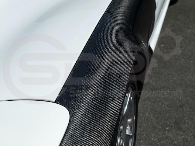 Factory style carbon fiber widebody fenders for 1997-2004 Chevrolet Corvette C5 hatchback by Street Driven Performance.