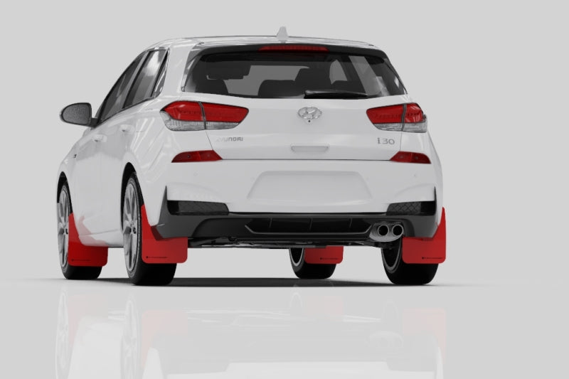 Rally Armor black mud flaps with blue logo for Hyundai Elantra GT N Line and i30, mounted on car wheels.