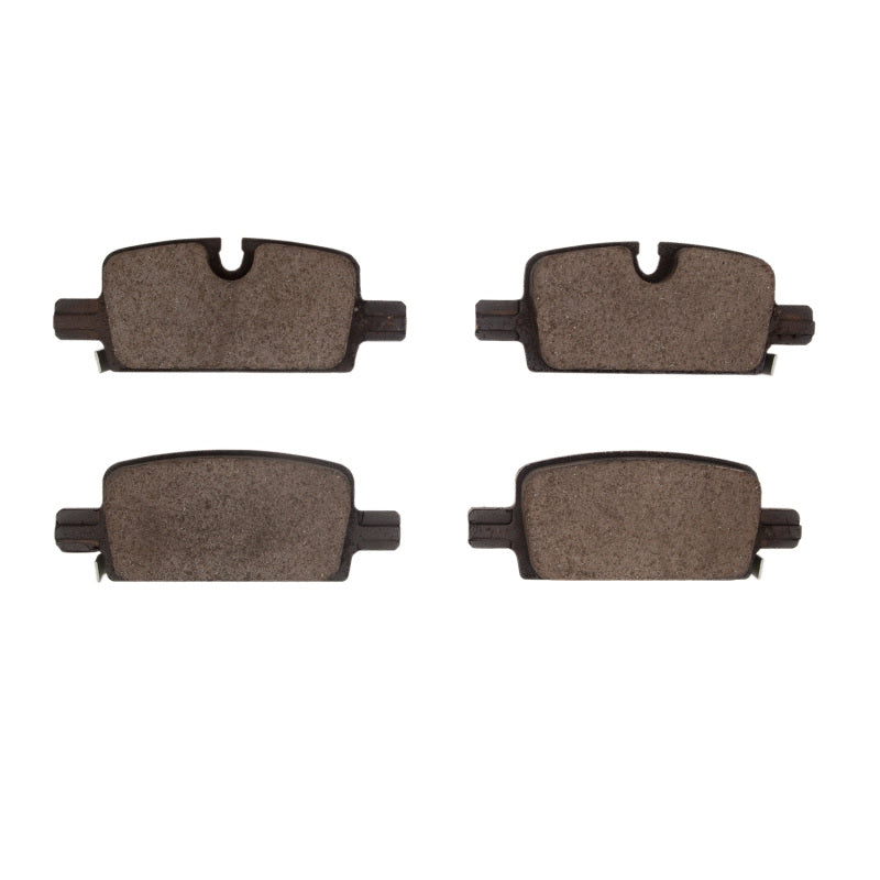 R1 Concepts OE rear ceramic brake pads for Rivian R1S, showing the new brake pad set with detailed friction surface.