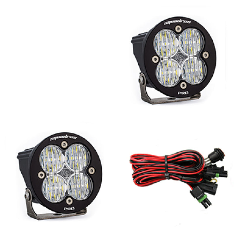 Pair of Baja Designs Squadron R Pro Wide Cornering LED light pods with clear lenses, designed for off-road vehicle lighting.