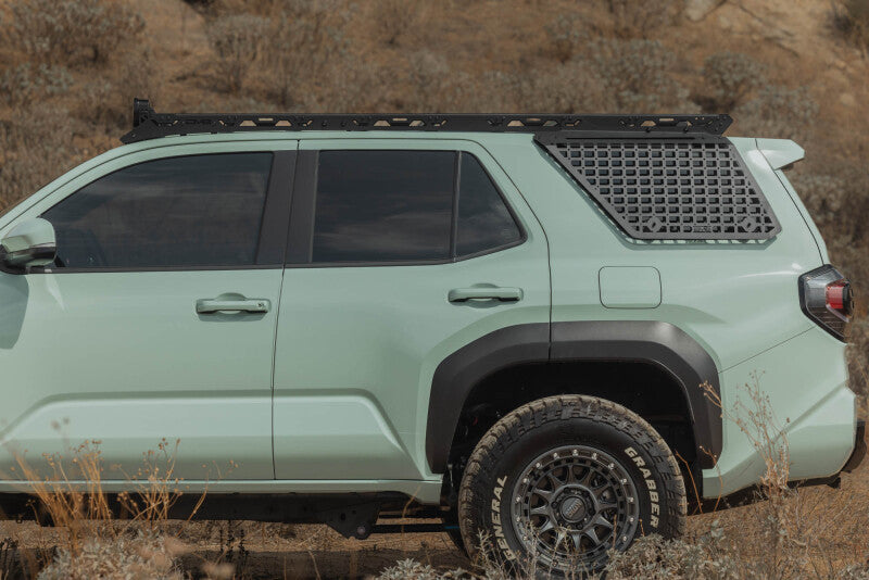DV8 Offroad Toyota 4Runner exterior window molle panel for DV8 roof rack, driver side, rugged metal exterior trim accessory.