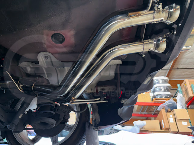 Hyundai Veloster Turbo exhaust axle back with dual 4-inch tips, available in burnt or chrome finish, by Street Driven Performance.