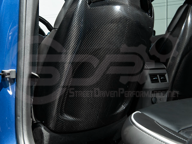 Pair of black carbon fiber seat back panels for Cadillac CT5-V and CT5-V Blackwing interior dash trim, driver and passenger sides.