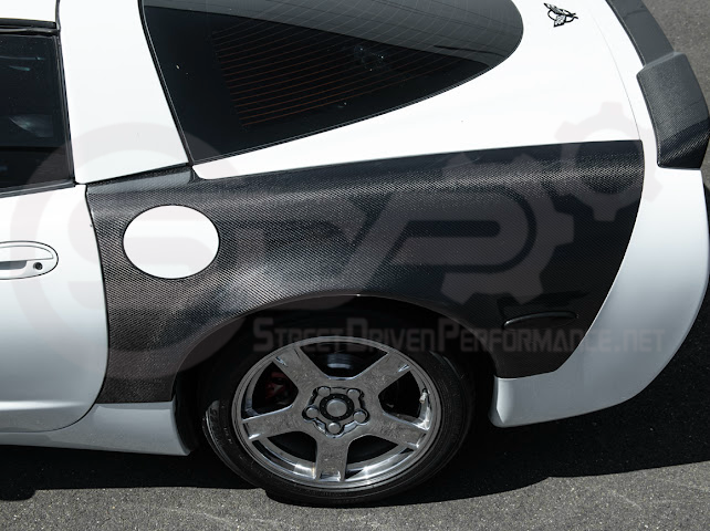 Factory style carbon fiber front and rear widebody fenders for 1997-2004 Chevrolet Corvette C5 hatchback by Street Driven Performance.