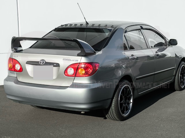 2003-2008 Toyota Corolla | JDM Tape-On Tinted Black Rear Roof Window Visor Guard