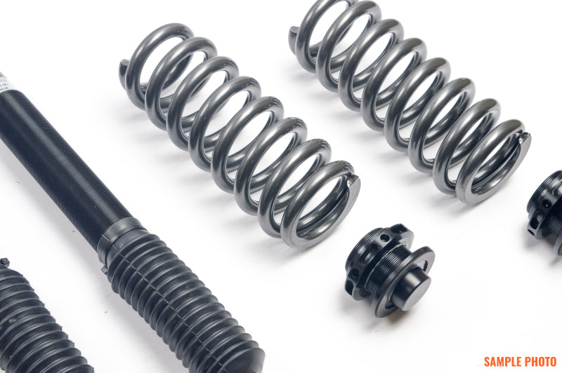 AST 5100 Series coilovers for BMW 1 Series E81/E82/E87/E88 rear, featuring adjustable coilover suspension components.