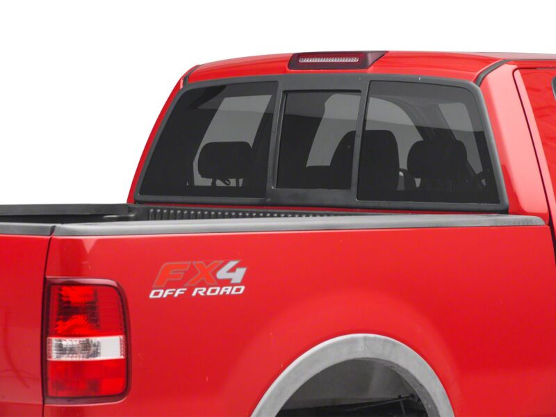 Raxiom 04-08 Ford F-150 Axial Series LED third brake light mounted on truck rear for enhanced visibility.