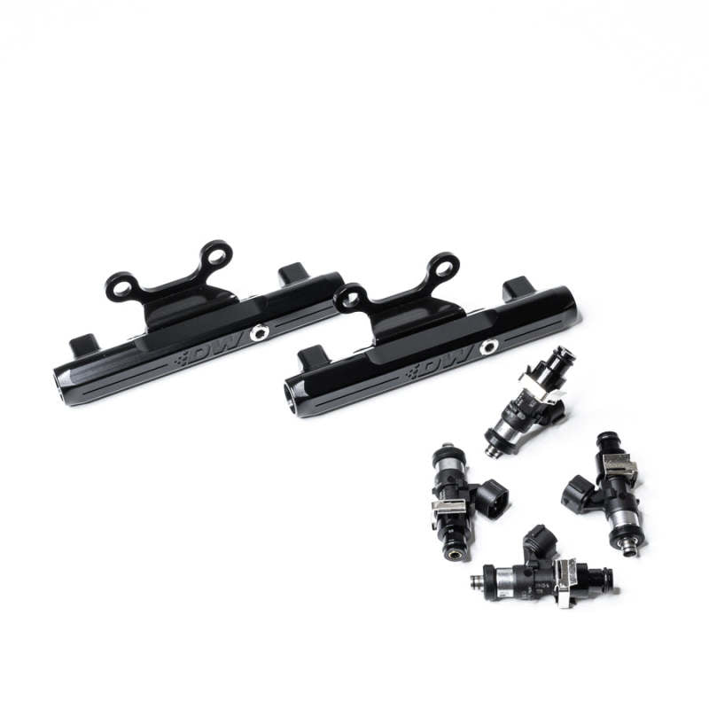 DeatschWerks fuel rail upgrade kit with 2200cc injectors for Subaru WRX 02+ and STI 07+ LGT, showing metal fuel rails and injectors.