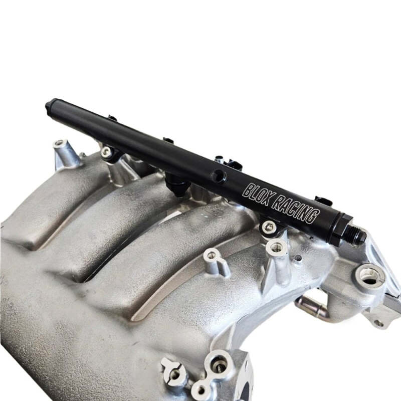 Black BLOX Racing Honda K-Series Xtreme aluminum fuel rail with mounting brackets and fuel inlet for performance engine upgrades.