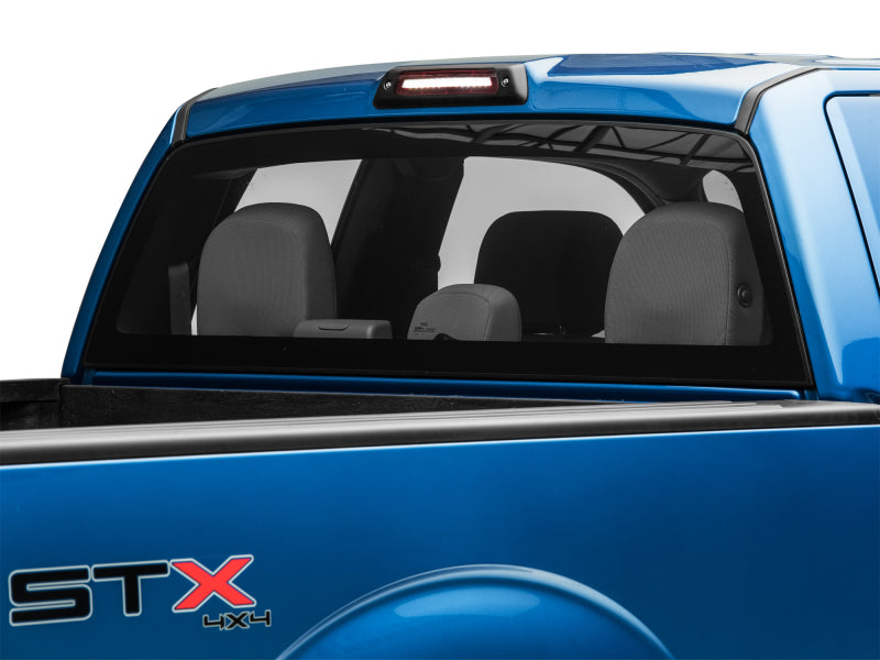 Raxiom LED third brake light for 2009-2014 Ford F-150 excluding Raptor, featuring a sleek axial design and bright illumination.