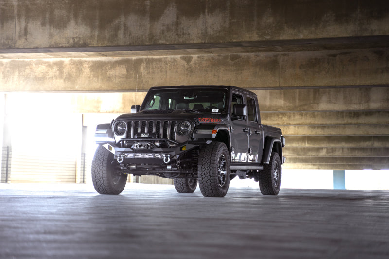 DV8 Offroad steel front bumper for Jeep Wrangler JK, JL, and Gladiator JT, featuring rugged off-road design and durable construction.
