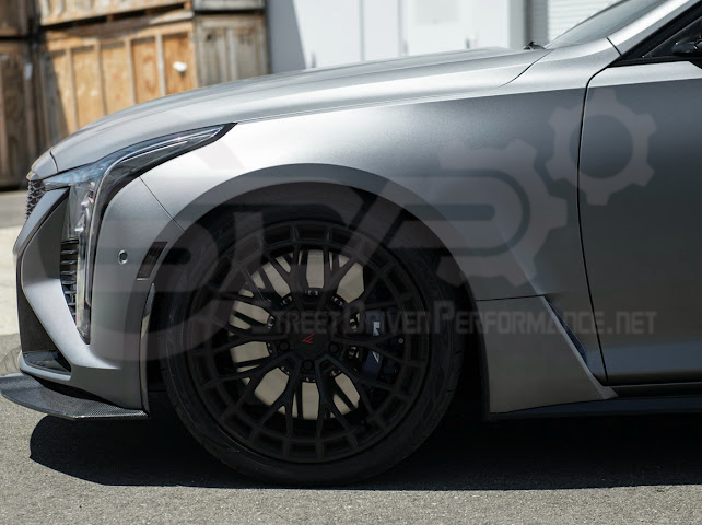 Cadillac CT5-V Blackwing factory OEM style carbon fiber front lip splitter and wheel arches, ground effects for enhanced sporty look.