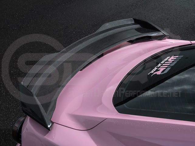 Dark Horse style carbon fiber rear wickerbill spoiler wing on a 2015-2023 Ford Mustang, showcasing sleek aerodynamic design.