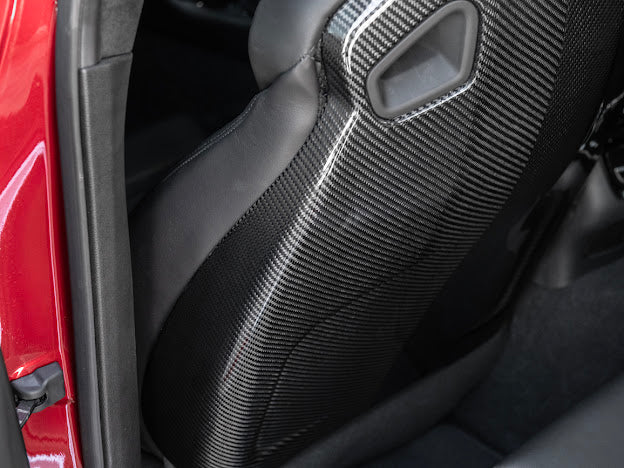 Cadillac ATS-V sedan Recaro carbon fiber seat rear panel cover replacement for driver and passenger sides.