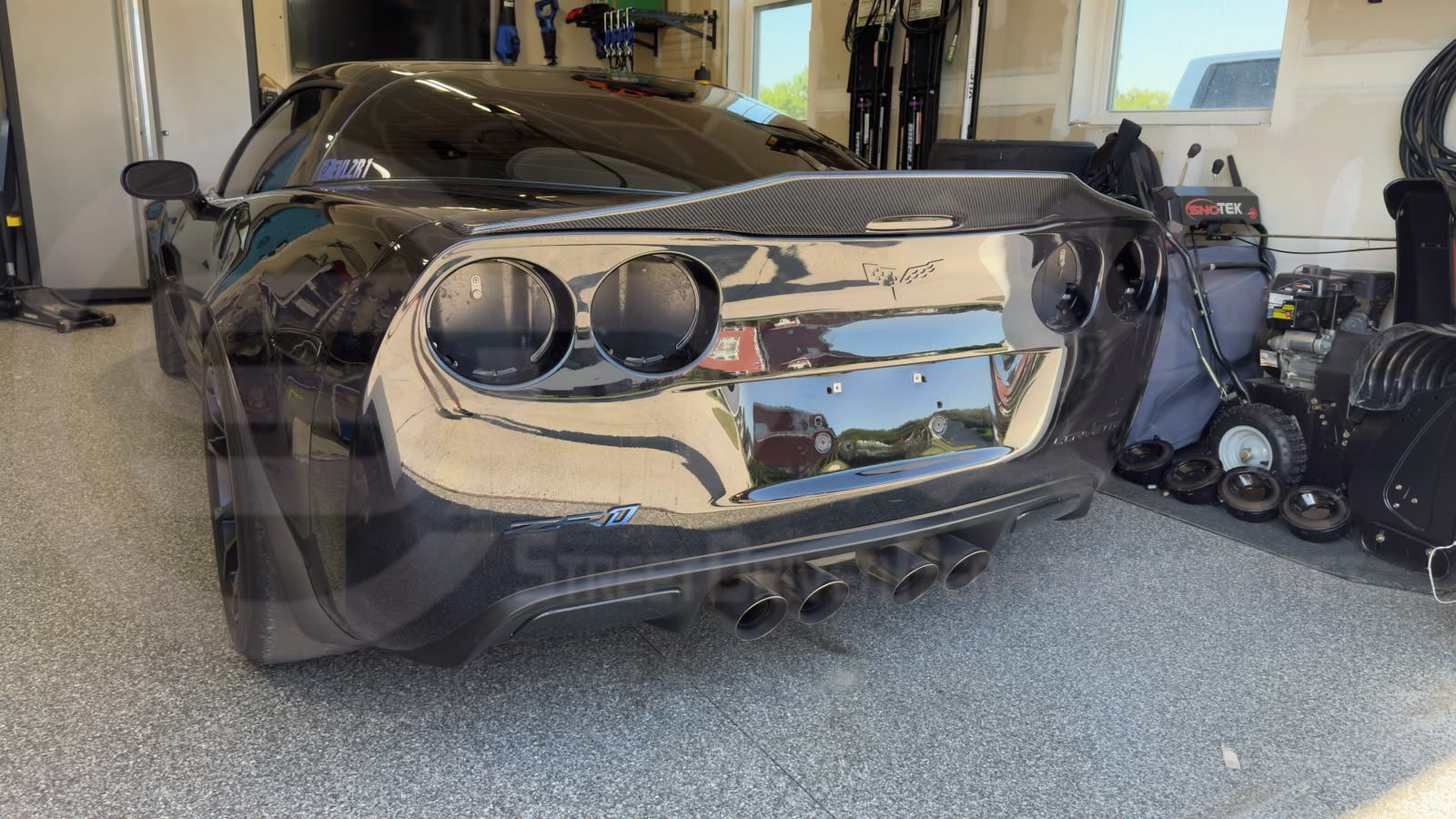 Carbon fiber rear trunk lid wing spoiler for 2005-2013 Chevrolet Corvette C6 by Street Driven Performance, showing an aggressive style design.