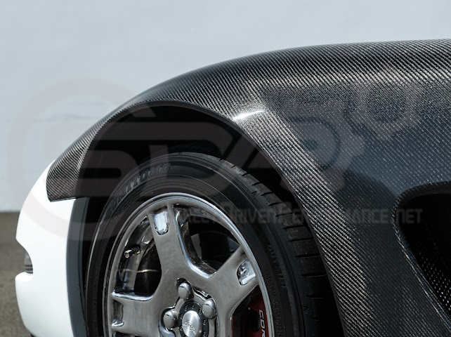 Factory style carbon fiber front and rear widebody fenders for Chevrolet Corvette C5 (1997-2004) by Street Driven Performance.