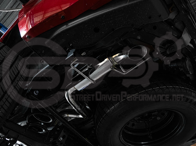 Toyota 4Runner cat-back exhaust system by Street Driven Performance with chrome or burnt blue turn down tips, installed on vehicle.