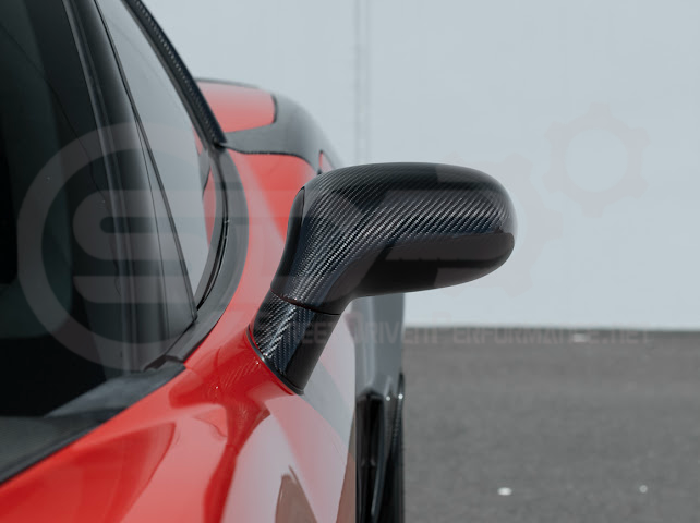 Set of four dry carbon fiber side mirror cap covers for 2005-2013 Chevy Corvette C6, tape-on style, by Street Driven Performance.